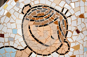 Child`s face made up of small pieces of tile photo