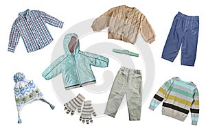 Child`s fashion autumn clothes set. Knitted cardigan,shirt trousers isolated on white. Winter collection boy`s clothing