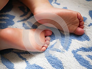 Child`s feet close-up. child 0-1 years old