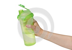 Child`s hand with a bottle of water.