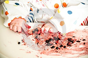 Child`s hand while eating berries