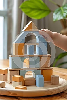 A child's hand holding a wooden block that looks like it is made of bricks, AI