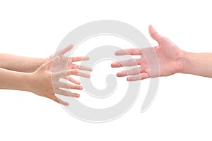 Child's hands reaching for adult's hand