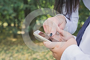 Child`s hands and smartphone