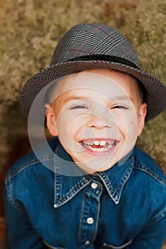 Child`s happy face . Portrait of a Cute Kid. little boy with sh