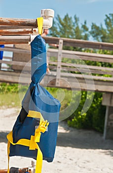 Child`s life vest at a tropical beach