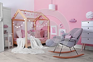 Child`s room interior with comfortable bed