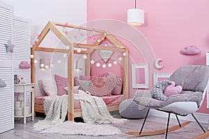 Child`s room interior with comfortable bed