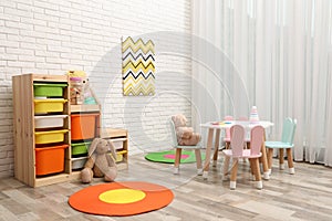 Child`s room interior with stylish furniture and toys