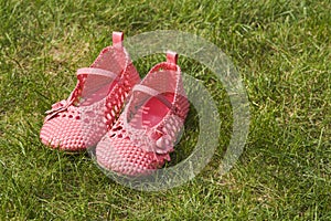 Child's shoes on garden grass