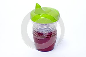 Child's sippy cup with juice