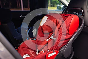 Child safety seat in the back of the car. Baby car seat for safety. Car interior. Car detailing.