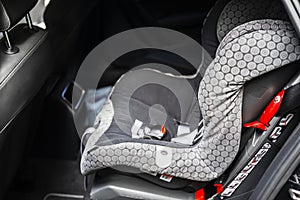 Child safety seat in the back of the car. Baby car seat for safety. Car interior. Car detailing. Child safety concept.