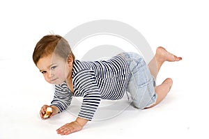 Child in sailor's striped vest crawl