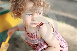 Child in sandpit photo