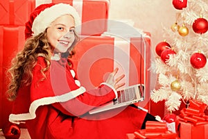 Child santa enjoy christmas eve. Girl little kid typing letter to santa on laptop. Child write letter to santa claus