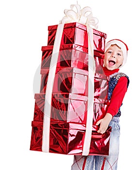 Child in Santa hat with stack gift box.