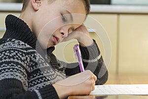 Child school age boy making his homework