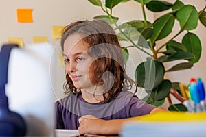 child at school. the child uses a laptop for learning. training using modern technologies