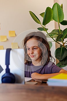 child at school. the child uses a laptop for learning. training using modern technologies