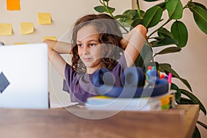 child at school. the child uses a laptop for learning. training using modern technologies