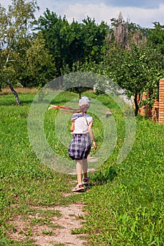 Child schooler with smartwatch running outdoor park. Kid using smartwatches active lifestyle sport. Schoolgirl walking