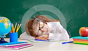 Child   schoolgirl  girl student tired, asleep about school blackboard