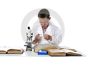 Child scientist looking at microscope slide