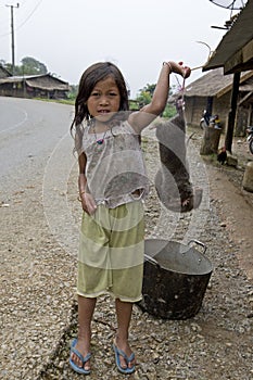 Child sell mole for a meal, Laos