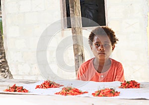 Child seller of chilli paprikas