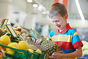 Child shopping at supermarket