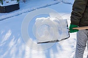 Child shoveling and removing snow