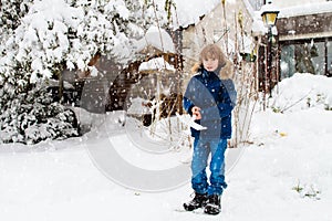 Child shoveling winter snow. Kids clear driveway