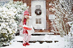 Child shoveling winter snow. Kids clear driveway