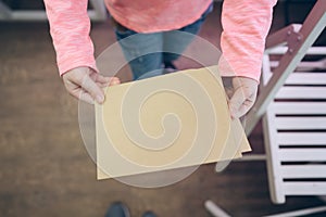 Child showing paper sheet for sales advertisement, copy space.