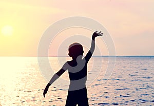 Child Silhouette with Hand Up