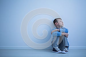 Child sitting on a floor