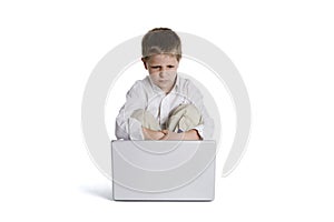 Child sitting in front of a laptop computer