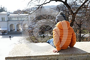 Child sitting on Lermontov site wall