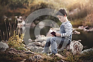 Child sitting reading a book