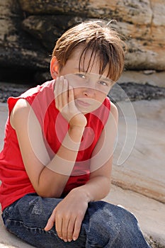 Child sitting on rocks