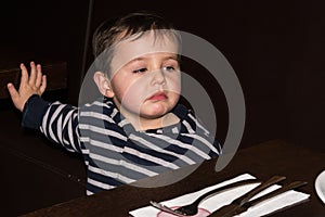 Child is sitting at table