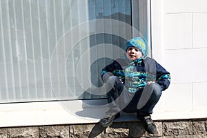 Child sitting on window tide