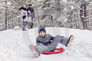 Child is skating on the ice-boat