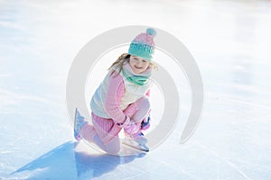 Child skating on natural ice. Kids with skates