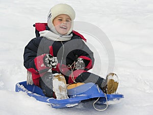 Child on sled photo