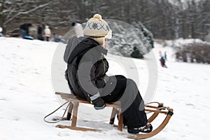 Child sledding - winter fun