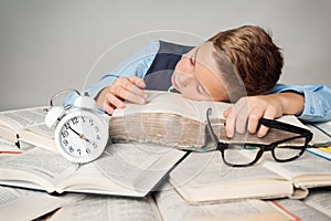 Child Sleep on Books, Tired Student Kid Studying, Lying on Book photo