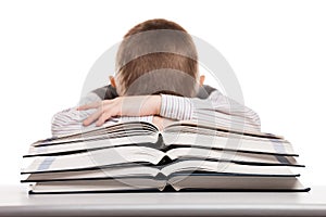 Child sleeping on reading books