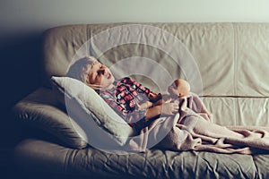 Child sleeping with toy.